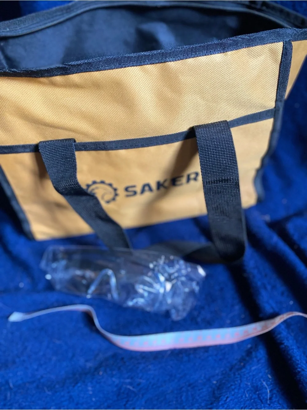Small gold and black tool bag with safety glasses- Saker